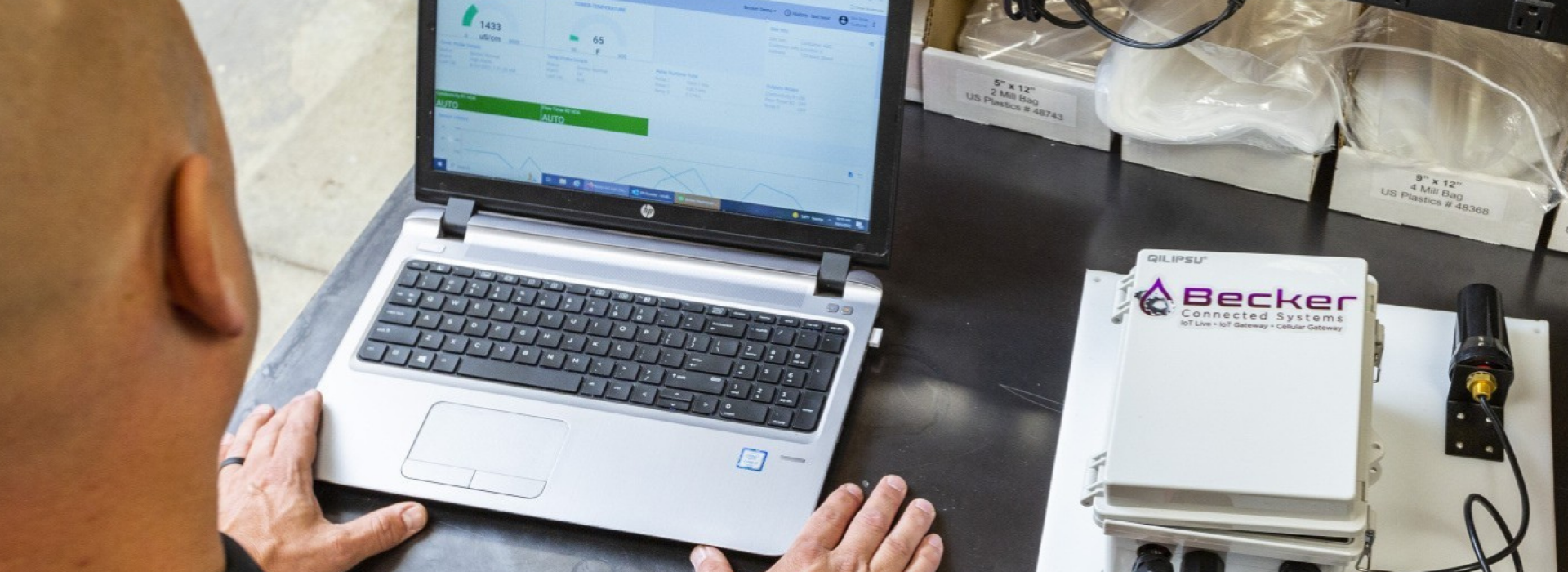 Two men looking at a computer